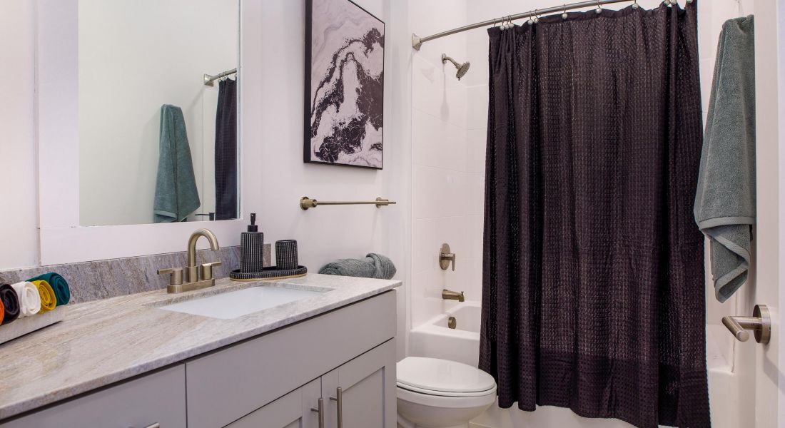Stylish bathroom at Wheatfield Village with modern fixtures and decor.