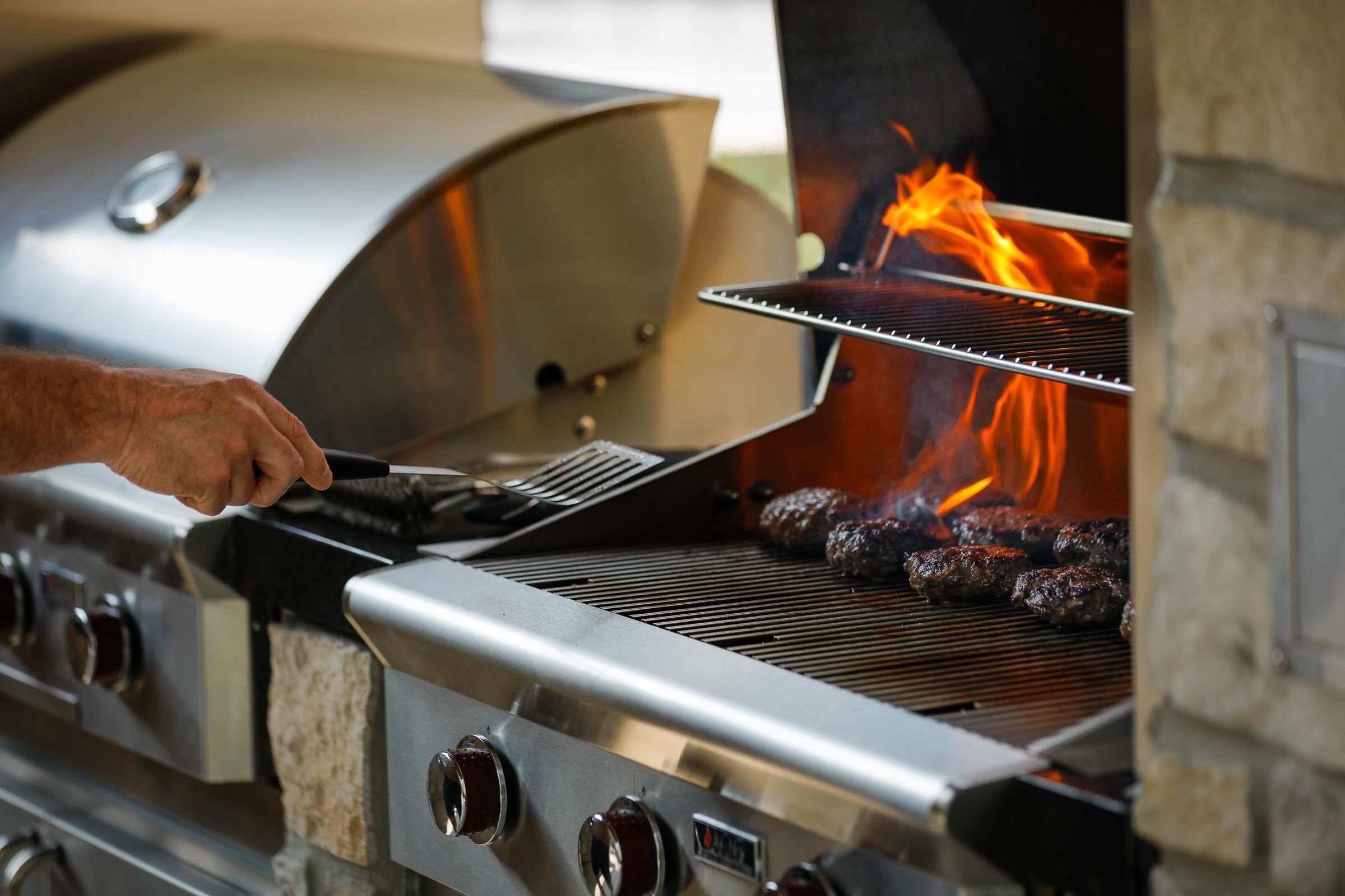Outdoor grilling station at Wheatfield Village with professional-grade equipment.